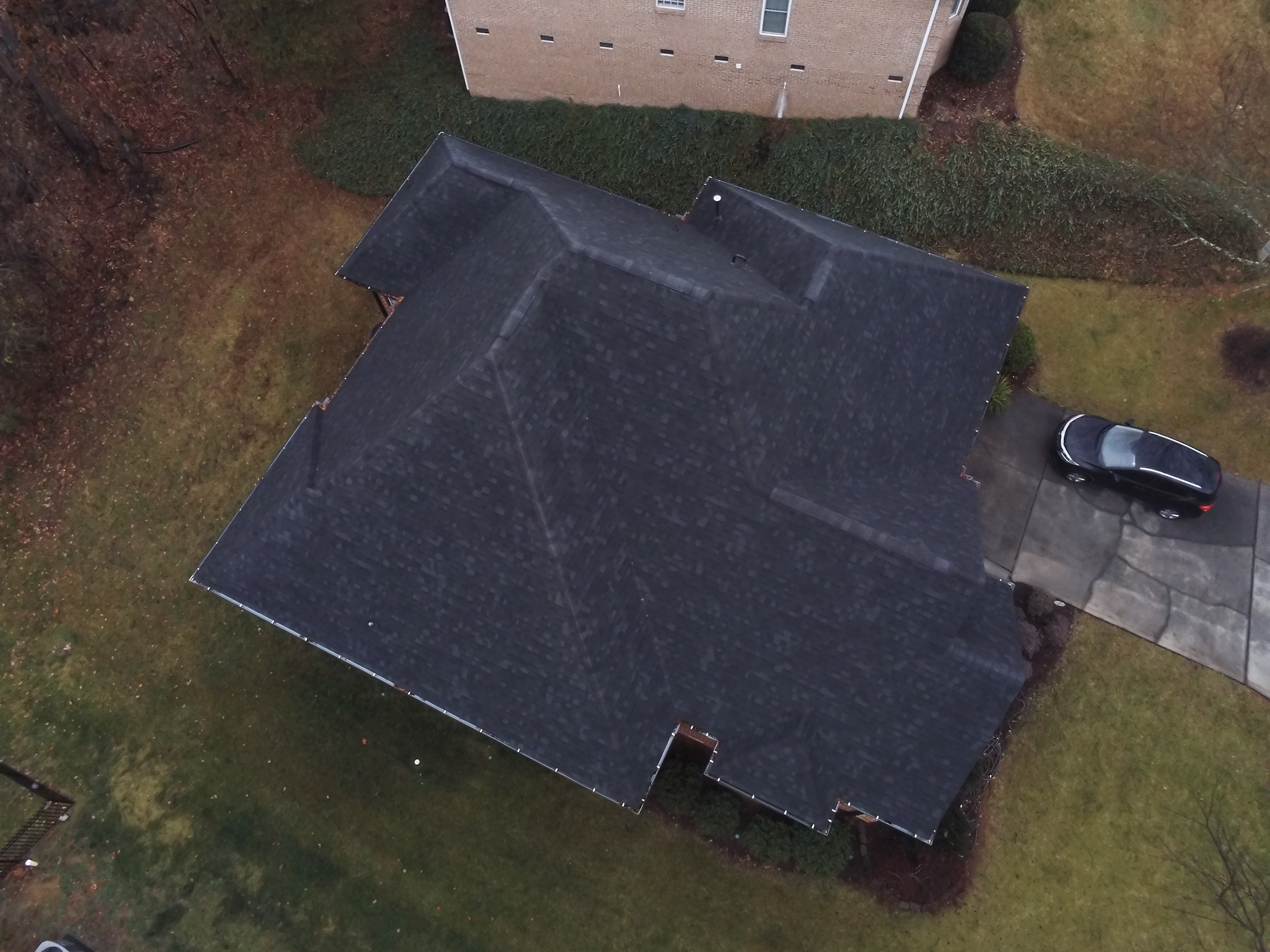 Drone-assisted storm damage roof overview during residential inspection in Gaston County NC